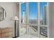 Bedroom featuring floor to ceiling windows and a view of the Stratosphere and the Las Vegas Strip at 2777 Paradise Rd # 1105, Las Vegas, NV 89109