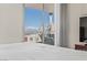 Cozy bedroom with floor-to-ceiling windows offering views of the Stratosphere and the Las Vegas Strip at 2777 Paradise Rd # 1105, Las Vegas, NV 89109