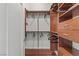 Organized walk-in closet with custom shelving and hanging rods, perfect for storage and organization at 2777 Paradise Rd # 1105, Las Vegas, NV 89109