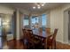 Charming dining room with hardwood floors, elegant table setting, and views of the city skyline and Stratosphere at 2777 Paradise Rd # 1105, Las Vegas, NV 89109