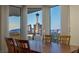 Bright dining room featuring wood table, matching chairs, floor to ceiling windows, and spectacular city views at 2777 Paradise Rd # 1105, Las Vegas, NV 89109