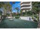 Well-maintained community dog park with synthetic turf, a convenient waste station, seating, and lush landscaping at 2777 Paradise Rd # 1105, Las Vegas, NV 89109