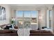 Bright living room with comfortable seating and access to a spacious balcony with city views at 2777 Paradise Rd # 1105, Las Vegas, NV 89109