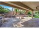 Covered patio with built-in fire pit and grill at 2891 Painted Lilly Dr, Las Vegas, NV 89135