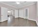 Bedroom with hardwood floors and access to another room at 2891 Painted Lilly Dr, Las Vegas, NV 89135