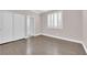 Bright bedroom with hardwood floors and double doors at 2891 Painted Lilly Dr, Las Vegas, NV 89135