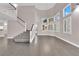 Bright entryway with elegant staircase and hardwood floors at 2891 Painted Lilly Dr, Las Vegas, NV 89135