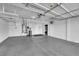 Garage with overhead storage and water softener at 2891 Painted Lilly Dr, Las Vegas, NV 89135