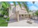 Two story house with backyard patio, fire pit and grill at 2891 Painted Lilly Dr, Las Vegas, NV 89135