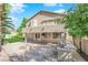 Two-story house with backyard patio, fire pit, and grill at 2891 Painted Lilly Dr, Las Vegas, NV 89135