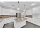 Modern kitchen with white cabinets, granite counters, and stainless steel appliances at 2891 Painted Lilly Dr, Las Vegas, NV 89135