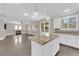 Open concept kitchen with granite island and stainless steel appliances at 2891 Painted Lilly Dr, Las Vegas, NV 89135