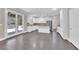 Kitchen with white cabinets, granite countertops and access to backyard at 2891 Painted Lilly Dr, Las Vegas, NV 89135