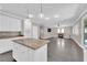 Open concept kitchen with granite island and stainless steel appliances at 2891 Painted Lilly Dr, Las Vegas, NV 89135