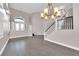 Living room with high ceilings, hardwood floors, and chandelier at 2891 Painted Lilly Dr, Las Vegas, NV 89135