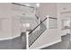 Two-story living room with hardwood floors and staircase at 2891 Painted Lilly Dr, Las Vegas, NV 89135