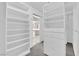 Spacious walk-in closet with built-in shelves and drawers at 2891 Painted Lilly Dr, Las Vegas, NV 89135