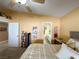 Primary bedroom featuring a bed, bathroom access, and a ceiling fan at 3254 Cactus Springs Dr, Laughlin, NV 89029