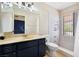 Bathroom featuring a shower, vanity with dark cabinets, and tiled floors at 3360 Paso Andres St, Las Vegas, NV 89146