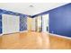 Spacious bedroom with wood floors and built-in closet at 3360 Paso Andres St, Las Vegas, NV 89146