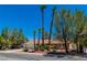 Single-story home with landscaping and palm trees at 3360 Paso Andres St, Las Vegas, NV 89146