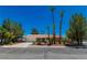 Single-story house with driveway and palm trees at 3360 Paso Andres St, Las Vegas, NV 89146