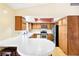 Kitchen with wood cabinets, stainless steel appliances, and a breakfast bar at 3360 Paso Andres St, Las Vegas, NV 89146