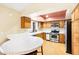 Kitchen boasts wood cabinets, stainless steel appliances, and a breakfast bar at 3360 Paso Andres St, Las Vegas, NV 89146