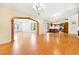 Open living room with hardwood floors and a view into the kitchen at 3360 Paso Andres St, Las Vegas, NV 89146