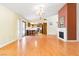 Open floor plan living room with kitchen and fireplace at 3360 Paso Andres St, Las Vegas, NV 89146