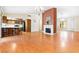 Open floor plan living room with kitchen and fireplace at 3360 Paso Andres St, Las Vegas, NV 89146