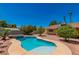 Inviting freeform swimming pool in backyard at 3360 Paso Andres St, Las Vegas, NV 89146