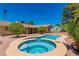 Relaxing kidney-shaped pool with adjacent spa at 3360 Paso Andres St, Las Vegas, NV 89146