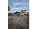 Exterior rear view featuring a concrete patio, neutral paint, and desert yard in need of landscaping at 3551 Rio Mayo Dr, Las Vegas, NV 89121