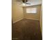 Simple bedroom featuring neutral carpet, a ceiling fan, and a window with blinds at 3551 Rio Mayo Dr, Las Vegas, NV 89121