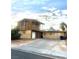 Two-story house with balcony, attached garage, and large yard at 3551 Rio Mayo Dr, Las Vegas, NV 89121