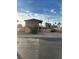Two story home featuring a balcony, neutral paint, small tree, and a long driveway at 3551 Rio Mayo Dr, Las Vegas, NV 89121