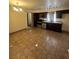 Functional kitchen featuring tile floors, modern appliances, and dark wood cabinets at 3551 Rio Mayo Dr, Las Vegas, NV 89121