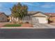 Single-story house with a two-car garage and landscaped front yard at 3713 Nairobi Ln, North Las Vegas, NV 89032