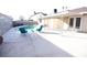 Backyard features a pool, covered patio, lounge chairs, and ample space at 3905 E Cherokee Ave, Las Vegas, NV 89121