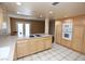 Functional kitchen layout with tile flooring, modern appliances, and abundant storage space at 3905 E Cherokee Ave, Las Vegas, NV 89121