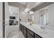 Bright and airy bathroom featuring a double sink vanity with granite countertop and modern fixtures at 4292 Helena Cove Ct, Las Vegas, NV 89129