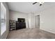 Bedroom with a dresser, TV, bookshelf, and a window offering natural light at 4292 Helena Cove Ct, Las Vegas, NV 89129