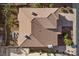 Overhead shot of a home displaying the roof, backyard layout with seating, and surrounding landscaping at 4439 Melrose Abbey Pl, Las Vegas, NV 89141