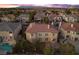 Aerial view of a house with a pool, outdoor seating area, and well-maintained landscaping in a residential neighborhood at 4439 Melrose Abbey Pl, Las Vegas, NV 89141