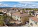 Spacious backyard features a cozy outdoor seating area, lush greenery, and mountain views in a Gathering-friendly neighborhood at 4439 Melrose Abbey Pl, Las Vegas, NV 89141