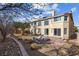 The landscaped backyard features a covered patio and manicured shrubbery at 4439 Melrose Abbey Pl, Las Vegas, NV 89141