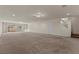 Spacious basement featuring neutral carpet, recessed lighting, and plenty of room for entertaining or relaxing at 4439 Melrose Abbey Pl, Las Vegas, NV 89141
