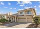 Charming two-story home boasts a three-car garage and well-maintained landscaping at 4439 Melrose Abbey Pl, Las Vegas, NV 89141