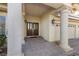 Grand front entrance featuring large pillars, a double door entry, and a covered porch at 4439 Melrose Abbey Pl, Las Vegas, NV 89141